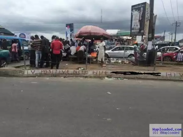 HIV Positive man advertises for wife in major Portharcourt junction (photos)